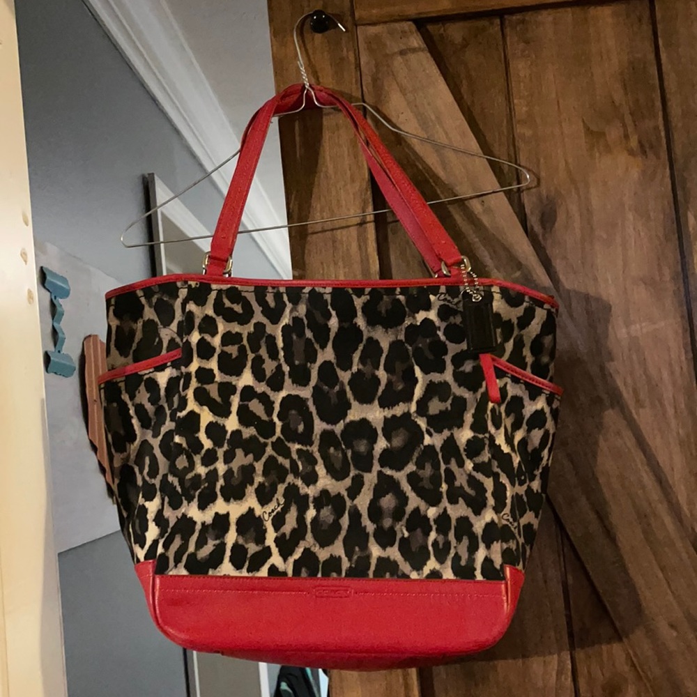 Coach handbag leopard with red.